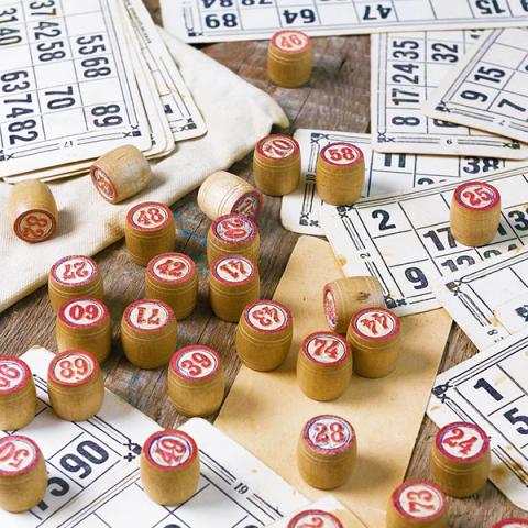 A photo of bingo boards and bingo pieces.