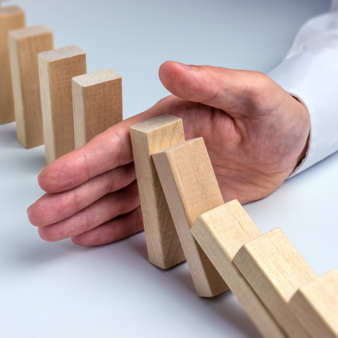 Hand blocking falling wooden blocks