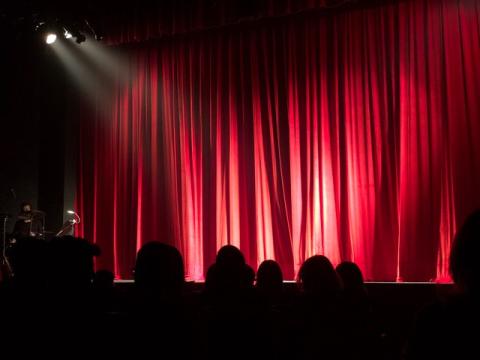 image of a stage curtain with spotlights on it - the show is about to start!