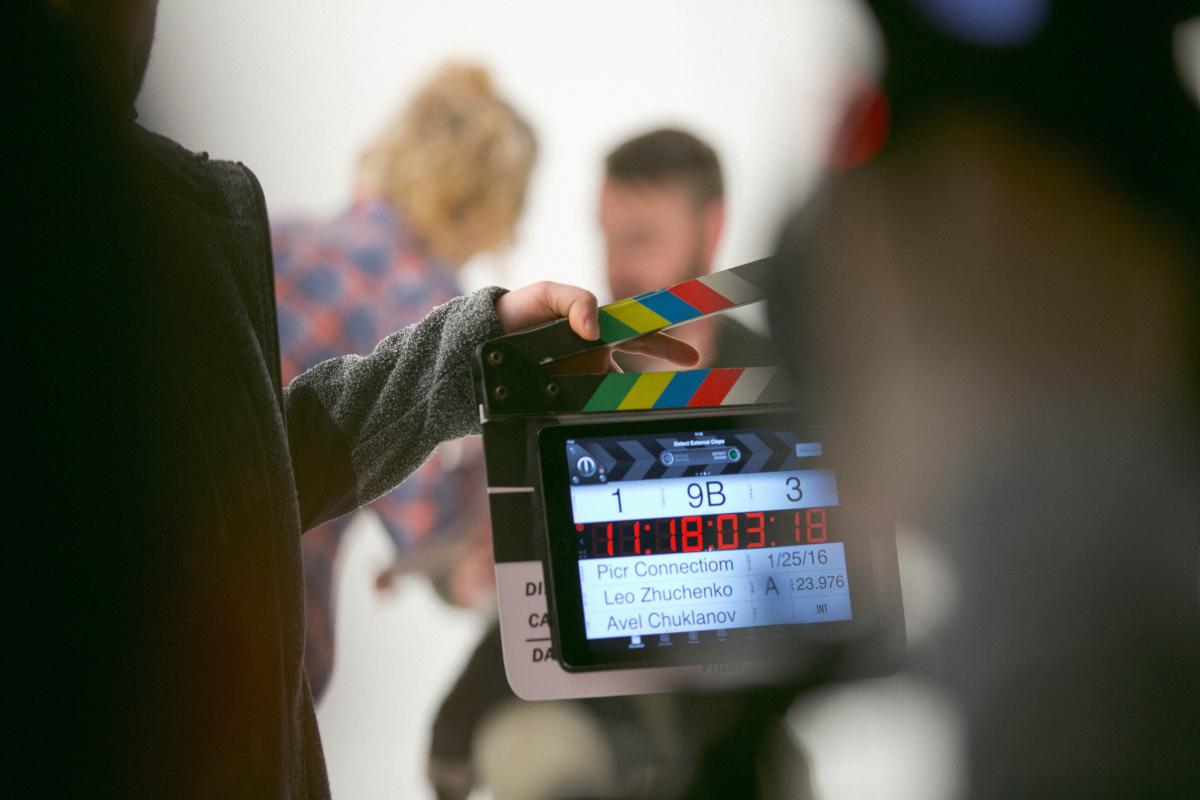 image of a movie set with a black and white clapperboard 