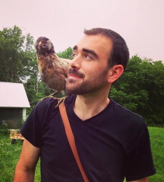 image of a farmer with a chicken on his shoulder