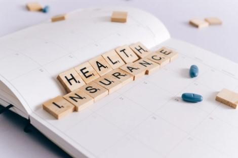 image of scrabble pieces that spell out the words health insurance